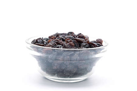 Cup of raisins on white backgroundの写真素材