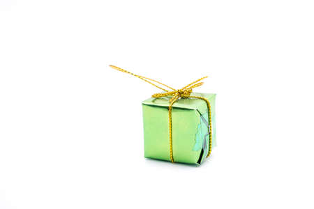 Small green gift box on white backgroundの写真素材