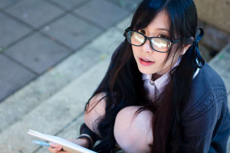 Asian girl in uniform studying in universityの写真素材