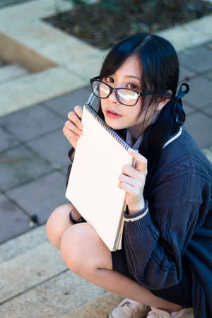 Asian girl in uniform studying in universityの写真素材