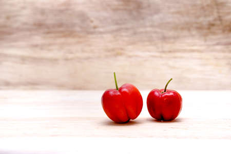 Red Barbados cherry on wooden backgroundの写真素材