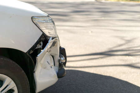 Car damage in the front bumper from accidentの写真素材