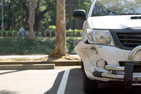 Car damage in the front bumper from accidentの写真素材
