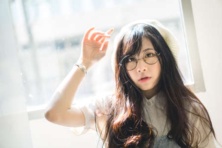 Portrait of charming Asian girl in film color styleの写真素材