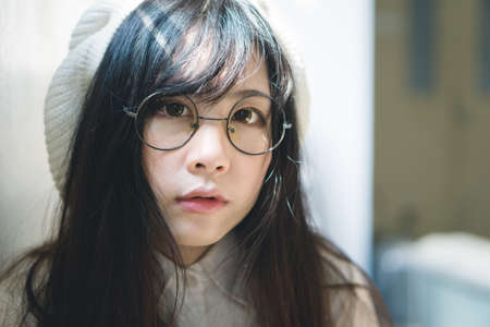 Portrait of charming Asian girl in film color styleの写真素材