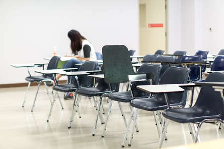 Thai lecture chairs and tables in classroomの写真素材