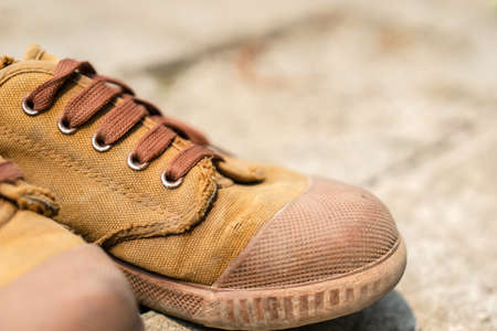 Old canvas Thai student shoesの写真素材