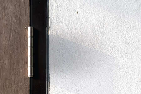 Old hinges on the wooden doorの写真素材