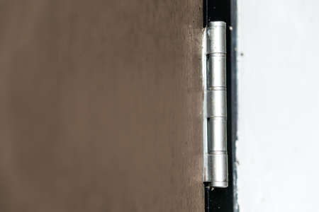 Old hinges on the wooden doorの写真素材