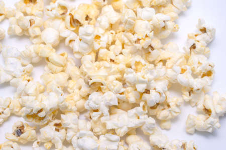 Close up of popcorn on white background