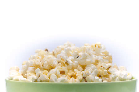 Close up of popcorn on white background