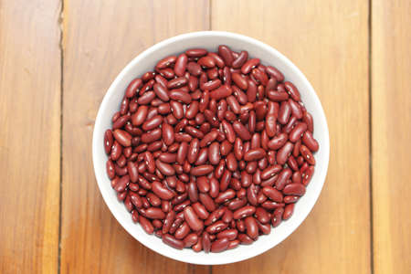 Red bean seed on wooden background