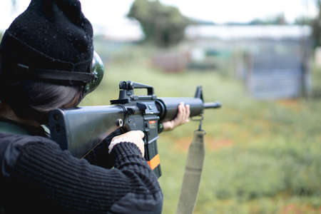 Thai air soft gun player in combat suit
