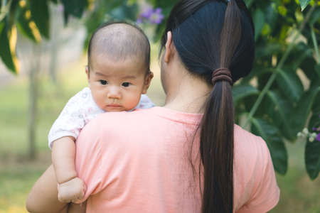 Asian mother playing with her sonの写真素材