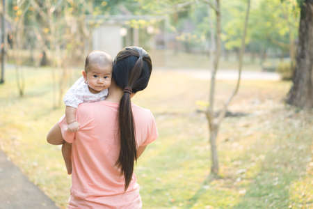 Asian mother playing with her sonの写真素材
