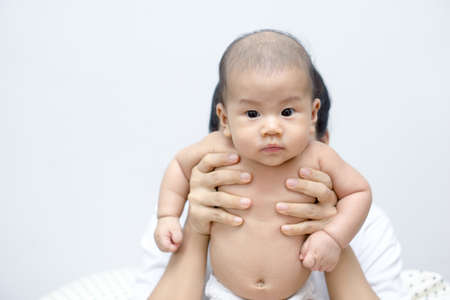 Asian mother playing with her sonの写真素材