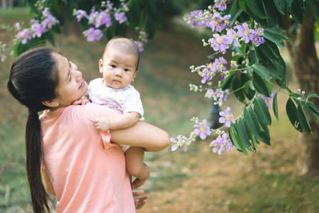 Asian mother playing with her sonの写真素材
