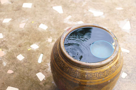 Thai traditional jar with rain waterの写真素材
