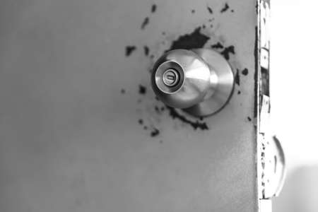 Door knob on rusty doorの写真素材
