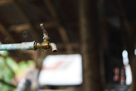 Rusty water tab with leaking waterの写真素材