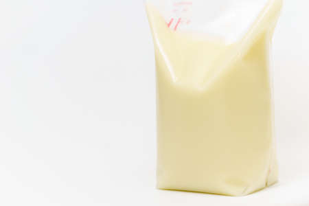Fresh breast milk in plastic bag ready for freezerの写真素材