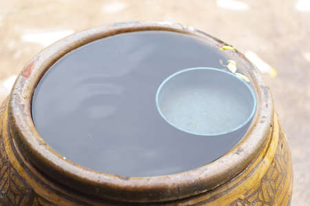 Thai traditional jar with rain waterの写真素材