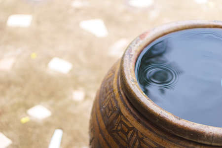 Thai traditional jar with rain waterの写真素材
