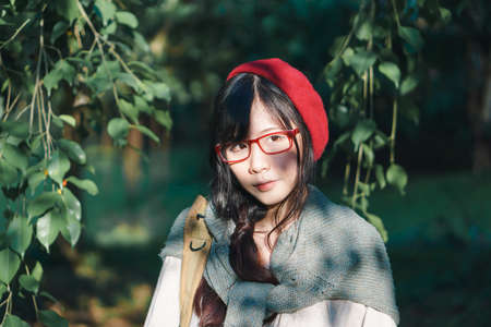 Charming Asian girl in the park