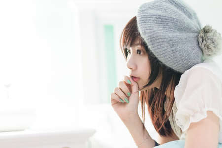 Charming Asian girl wearing pajamas on the bedの写真素材