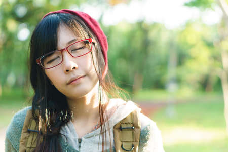 Charming Asian girl in the park