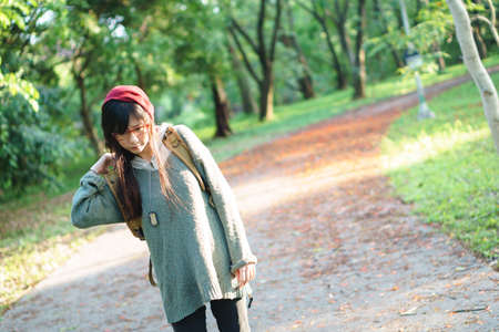 Charming Asian girl in the parkの写真素材