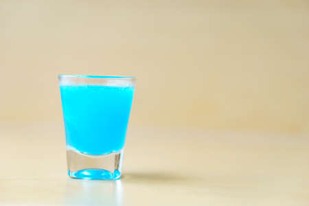 Blue kamikaze cocktail on wooden background