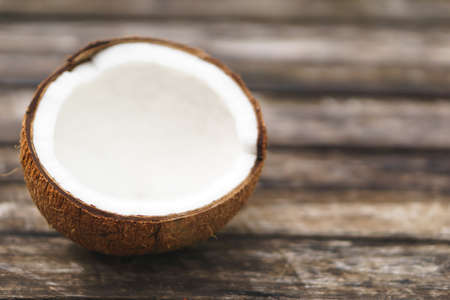 coconut with shell on wooden background