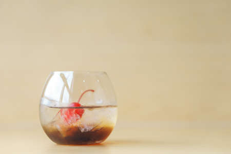 Black russian cocktail on wooden background