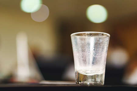 An empty shot glass after drinkの写真素材