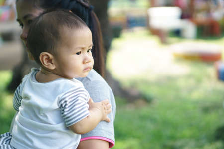 Asian mother holding her sonの写真素材