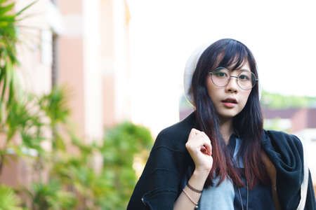 Portrait of charming Asian girl in the parkの写真素材