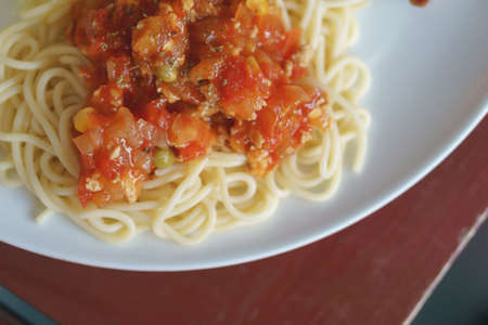 Dish of chicken spaghetti with pork steakの写真素材