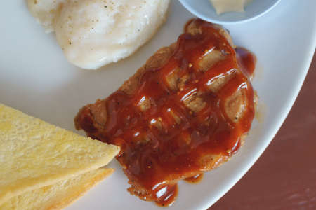 Dish of chicken spaghetti with pork steakの写真素材