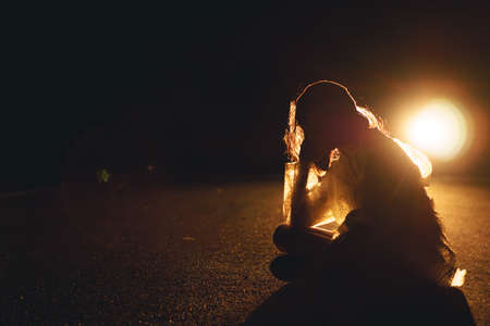 Night portrait of charming Asian girl at nightの写真素材