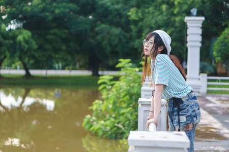 Charming Asian girl wearing jean overallsの写真素材