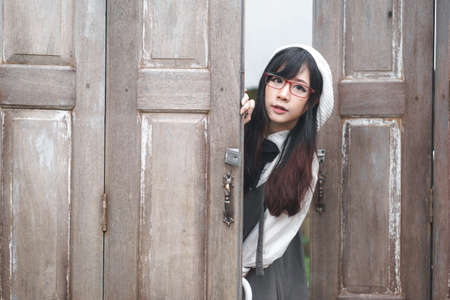 Charming Asian girl with umbrella in raining day