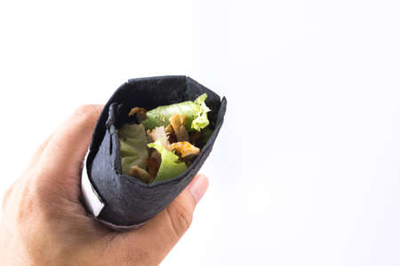 Dark chicken kebab on white backgroundの写真素材