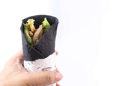 Dark chicken kebab on white backgroundの写真素材