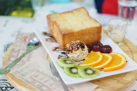 Honey toast with icecream and fruitsの写真素材