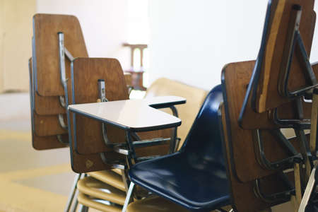 Thai lecture chairs and tables in front of classroomの写真素材