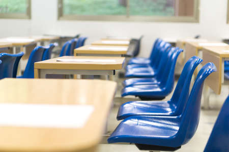 Thai lecture chairs and tables in classroomの写真素材