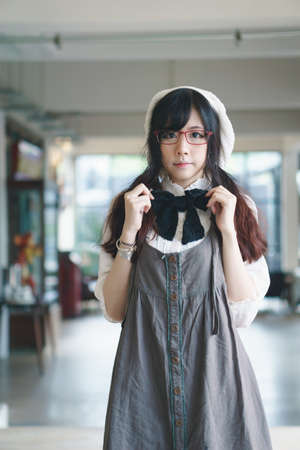 Portrait of charming Asian girl in a coffee shop