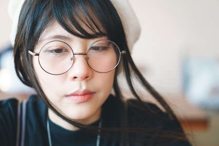 Portrait of charming Asian girl in film color styleの写真素材