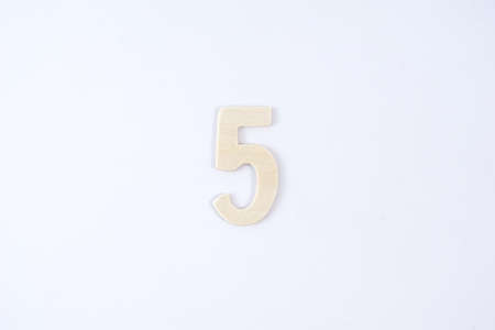 Wooden number five on white backgroundの写真素材